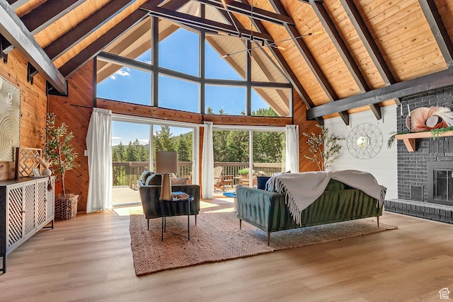 575 Upper Evergreen Dr, Park City, UT 84098 - living area featuring wood walls, high vaulted ceiling, healthy amount of natural light, a wood ceiling with exposed beams, and wood finished floors