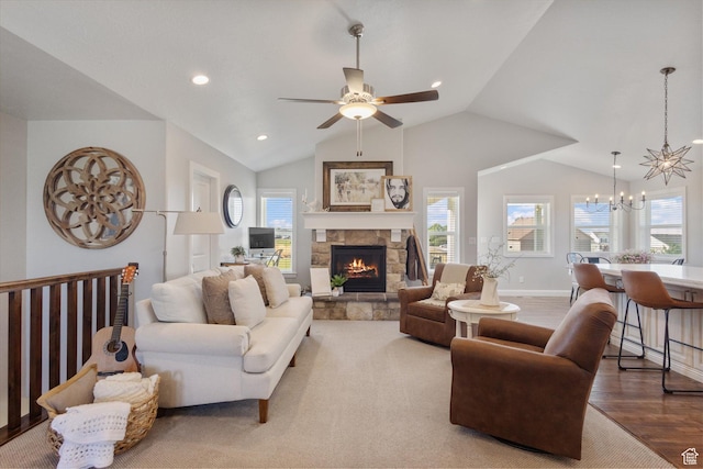 13 W 1370 S, Mona, UT 84645 - living area with a chandelier, ceiling fan, wood finished floors, vaulted ceiling, and a fireplace