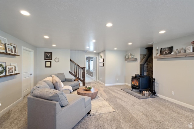 13 W 1370 S, Mona, UT 84645 - living area featuring a wood stove, light carpet, recessed lighting, and stairs