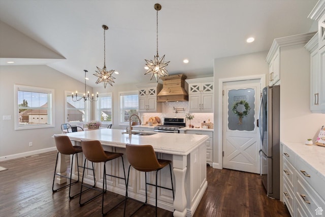 13 W 1370 S, Mona, UT 84645 - kitchen with custom exhaust hood, appliances with stainless steel finishes, a chandelier, tasteful backsplash, and a kitchen breakfast bar