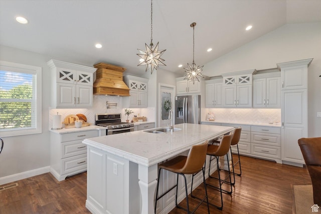 13 W 1370 S, Mona, UT 84645 - kitchen featuring appliances with stainless steel finishes, custom range hood, white cabinets, decorative backsplash, and dark wood finished floors