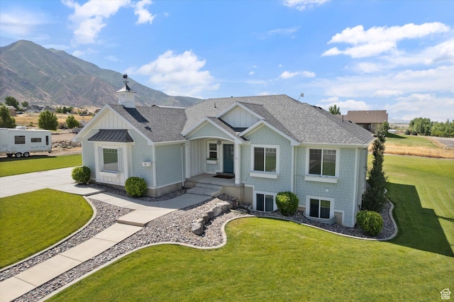 13 W 1370 S, Mona, UT 84645 - view of front facade with a shingled roof, a front lawn, a mountain view, and board and batten siding