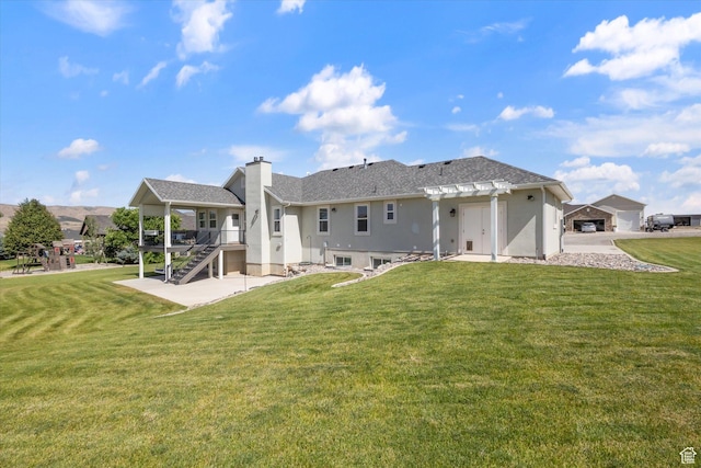 13 W 1370 S, Mona, UT 84645 - rear view of house featuring a lawn, stairway, a chimney, and a pergola