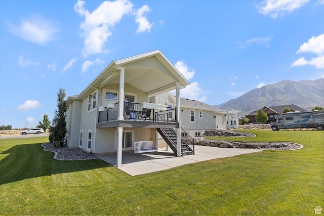 13 W 1370 S, Mona, UT 84645 - back of property featuring a patio, a mountain view, stairs, stucco siding, and a yard