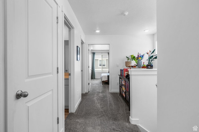 943 E Drifter Ln, Saratoga Springs, UT 84045 - hall featuring dark carpet and baseboards