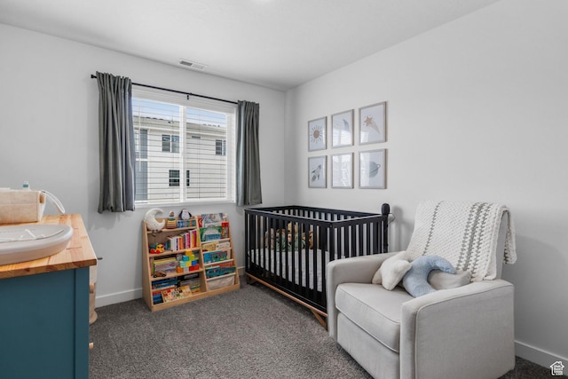 943 E Drifter Ln, Saratoga Springs, UT 84045 - carpeted bedroom featuring a nursery area and baseboards