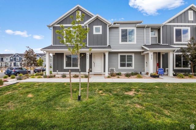 943 E Drifter Ln, Saratoga Springs, UT 84045 - craftsman-style house with board and batten siding and a front lawn