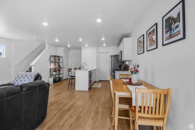 943 E Drifter Ln, Saratoga Springs, UT 84045 - dining room with light wood-style floors, stairs, and recessed lighting