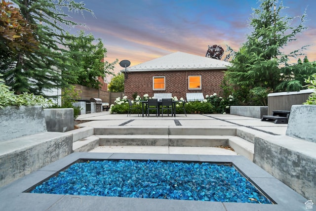 1221 E 800 S, Salt Lake City, UT 84102 - pool at dusk with a patio area and outdoor dining area