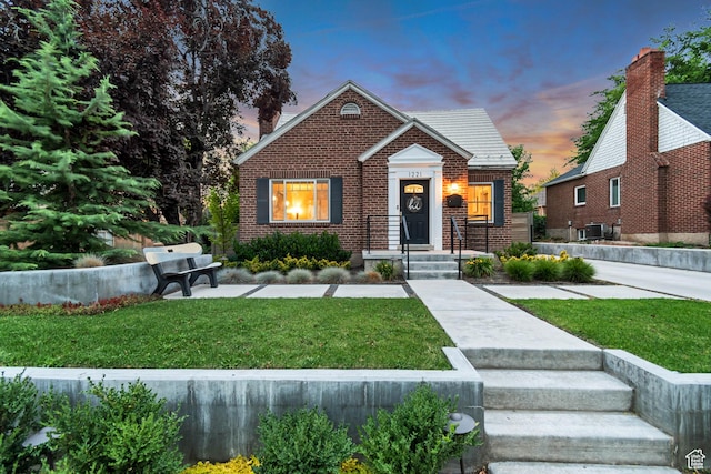 1221 E 800 S, Salt Lake City, UT 84102 - bungalow-style home featuring brick siding and a lawn