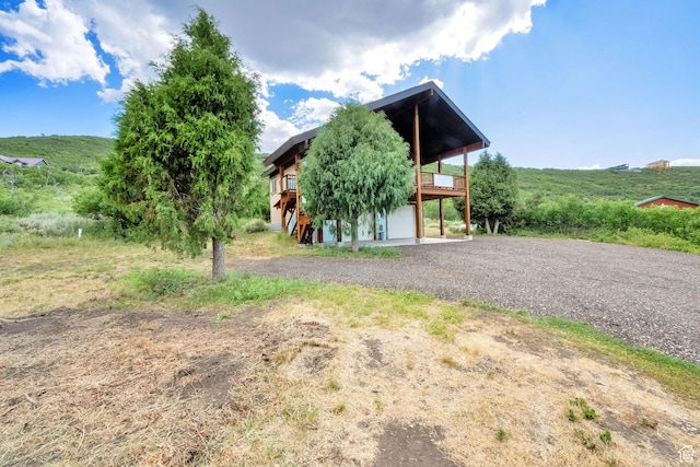 1674 S Cottonwood Ct Unit 1217, Heber City, UT 84032 - view of front facade with driveway, a deck, and a garage
