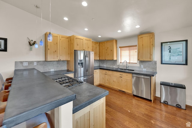 1674 S Cottonwood Ct Unit 1217, Heber City, UT 84032 - kitchen featuring appliances with stainless steel finishes, light brown cabinets, a peninsula, dark countertops, and recessed lighting