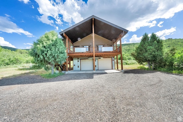 1674 S Cottonwood Ct Unit 1217, Heber City, UT 84032 - view of front facade featuring gravel driveway, an attached garage, and a deck