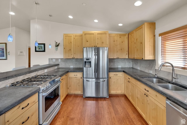 1674 S Cottonwood Ct Unit 1217, Heber City, UT 84032 - kitchen featuring appliances with stainless steel finishes, light brown cabinets, vaulted ceiling, dark countertops, and light wood-style flooring