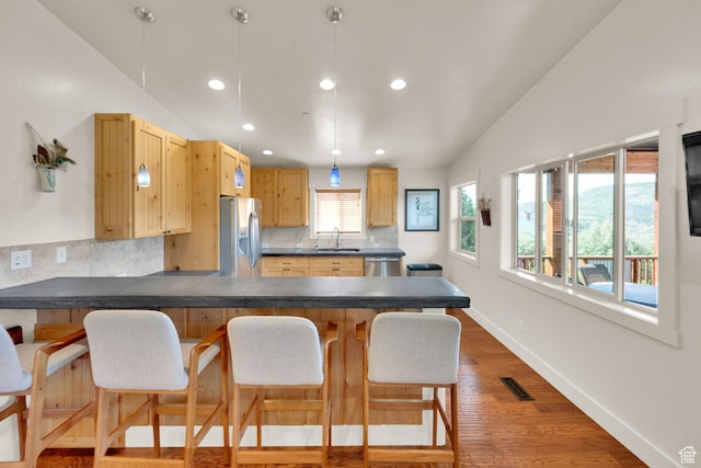 1674 S Cottonwood Ct Unit 1217, Heber City, UT 84032 - kitchen featuring stainless steel appliances, dark countertops, backsplash, recessed lighting, and a peninsula