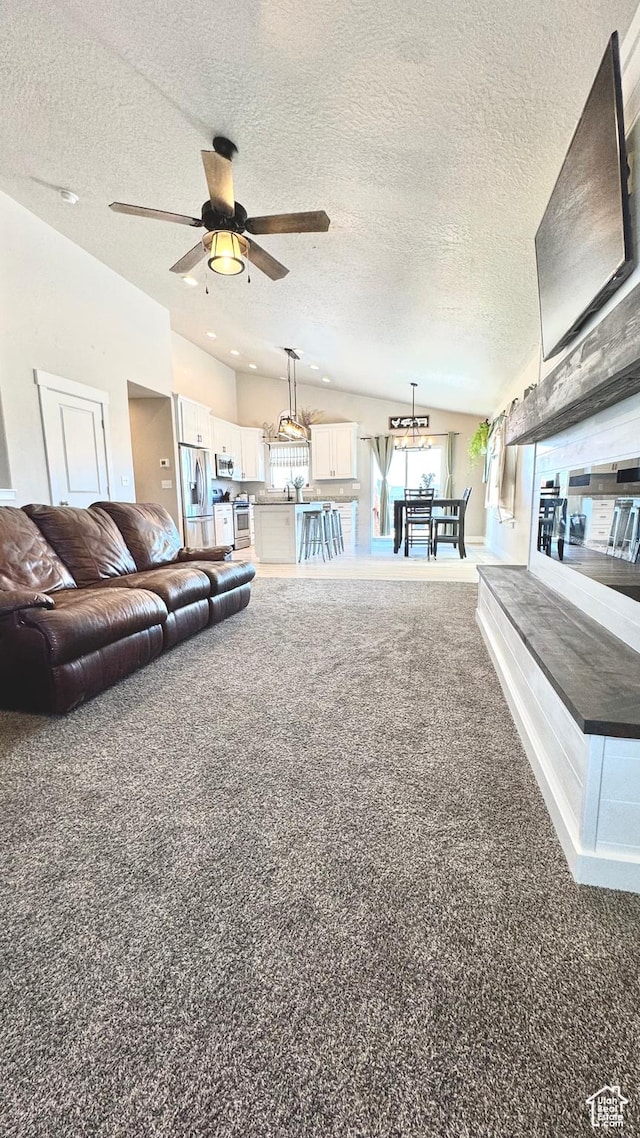 2408 E Maple Dr, Eagle Mountain, UT 84005 - living area with carpet, a chandelier, a textured ceiling, and ceiling fan