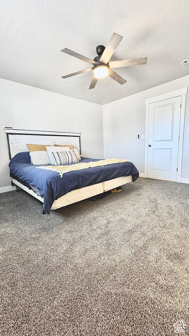 2408 E Maple Dr, Eagle Mountain, UT 84005 - bedroom with a textured ceiling, carpet, and ceiling fan