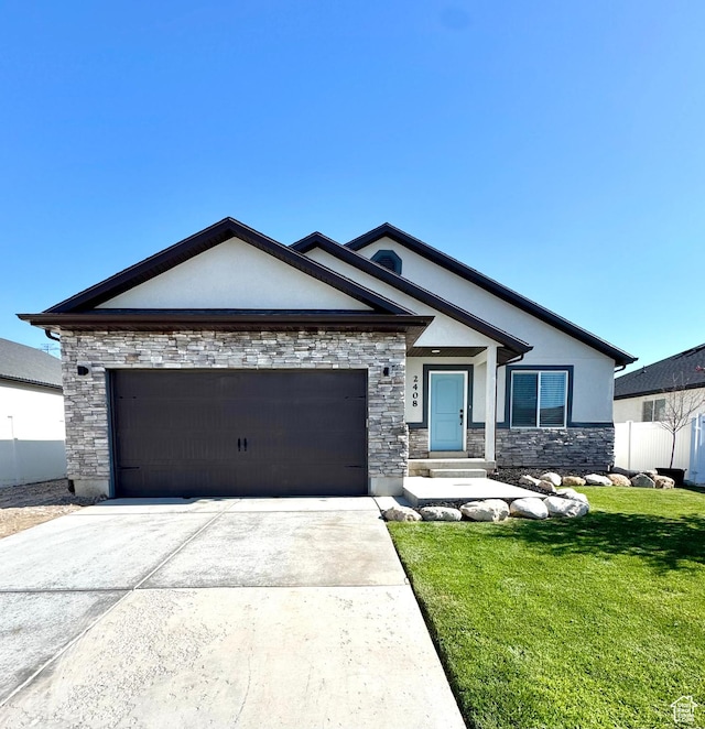 2408 E Maple Dr, Eagle Mountain, UT 84005 - view of front of property with stucco siding, stone siding, an attached garage, and driveway