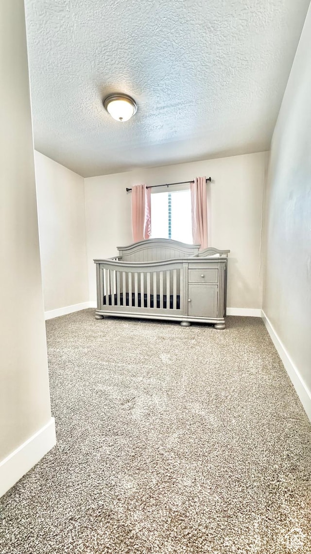 2408 E Maple Dr, Eagle Mountain, UT 84005 - carpeted spare room featuring a textured ceiling and baseboards