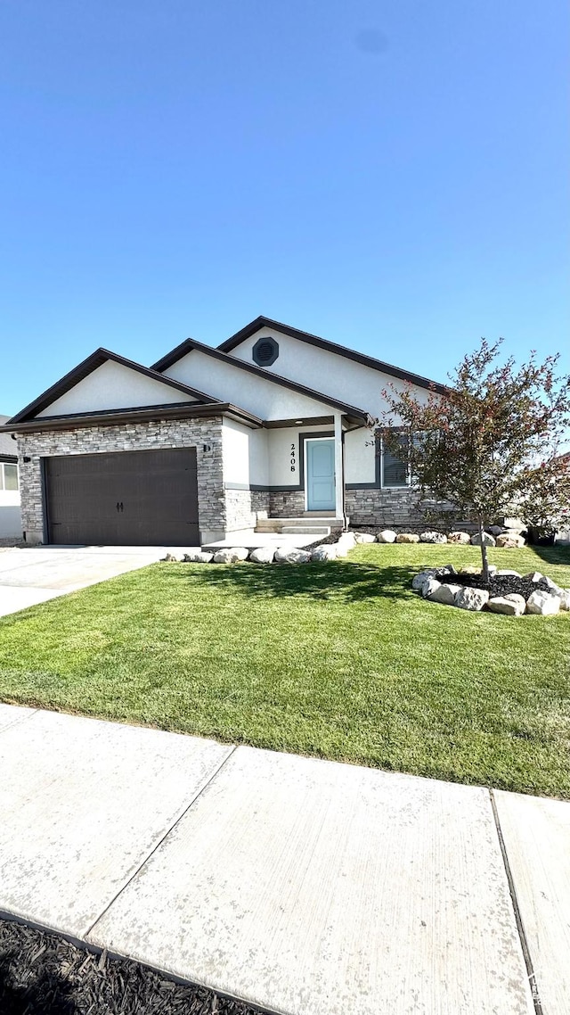 2408 E Maple Dr, Eagle Mountain, UT 84005 - view of front of property featuring stone siding, a garage, a front lawn, driveway, and stucco siding