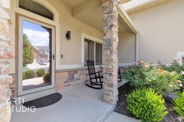 2244 S Hunter Dr, Saratoga Springs, UT 84045 - property entrance featuring stucco siding, a porch, and stone siding