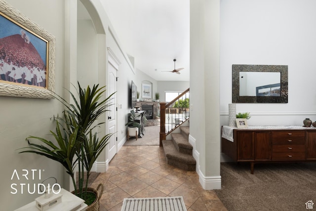 2244 S Hunter Dr, Saratoga Springs, UT 84045 - hallway with arched walkways, carpet, and stairs