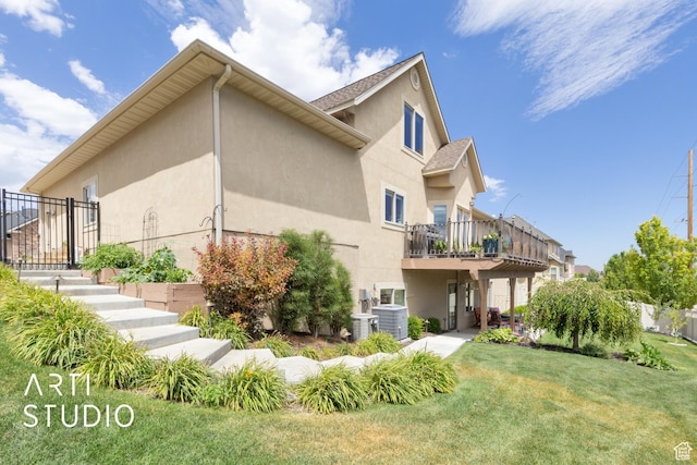 2244 S Hunter Dr, Saratoga Springs, UT 84045 - view of property exterior featuring stucco siding, a lawn, and stairway