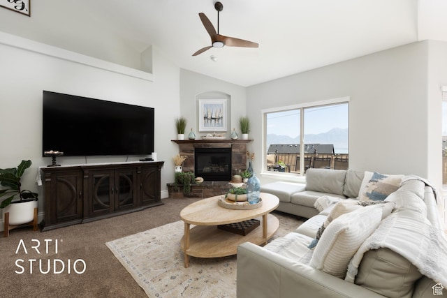 2244 S Hunter Dr, Saratoga Springs, UT 84045 - living area with a ceiling fan, carpet floors, lofted ceiling, a stone fireplace, and a mountain view