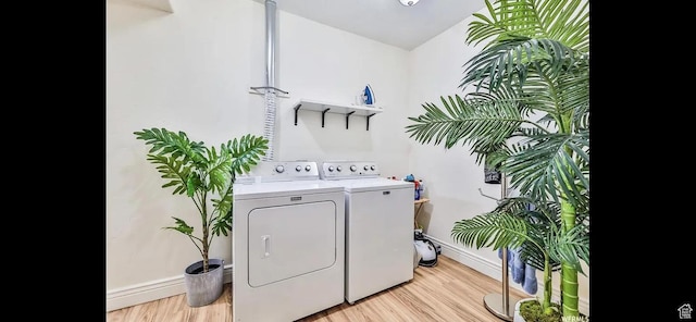 2244 S Hunter Dr, Saratoga Springs, UT 84045 - laundry area featuring washing machine and dryer and light wood finished floors