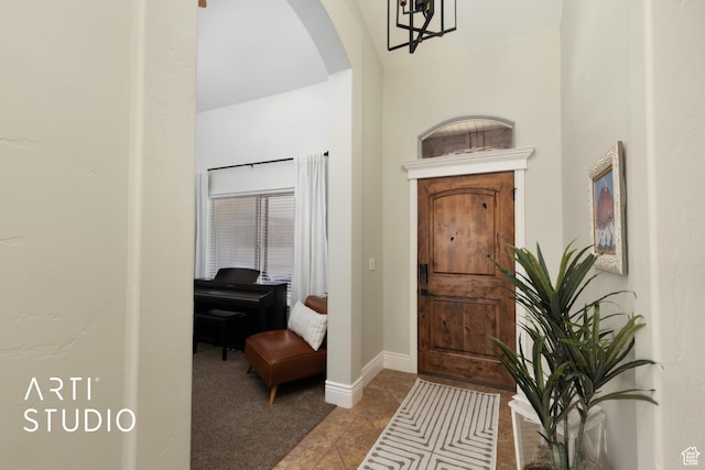 2244 S Hunter Dr, Saratoga Springs, UT 84045 - entryway with arched walkways and a chandelier
