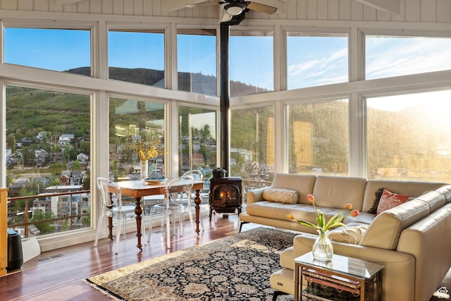 235 Mchenry Ave, Park City, UT 84060 - sunroom with a wood stove and wood finished floors