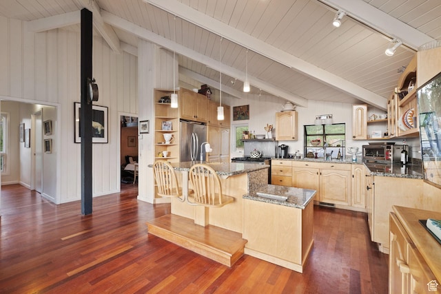 235 Mchenry Ave, Park City, UT 84060 - kitchen with open shelves, rail lighting, appliances with stainless steel finishes, a center island with sink, and light brown cabinetry