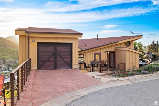 235 Mchenry Ave, Park City, UT 84060 - view of front of house featuring a garage and roof with shingles