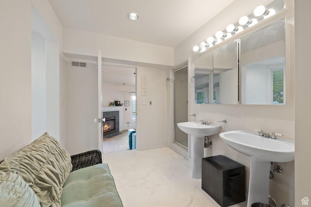 235 Mchenry Ave, Park City, UT 84060 - bathroom with a tiled fireplace and recessed lighting