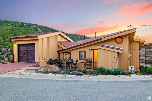 235 Mchenry Ave, Park City, UT 84060 - view of front facade featuring decorative driveway and an attached garage