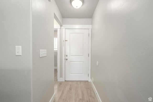 1728 E Shadow Dr, Eagle Mountain, UT 84005 - hall with light wood-style flooring and baseboards