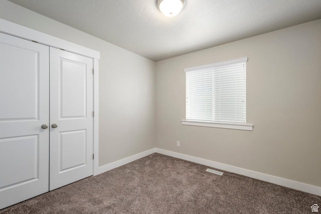 1728 E Shadow Dr, Eagle Mountain, UT 84005 - unfurnished bedroom featuring carpet flooring and a closet