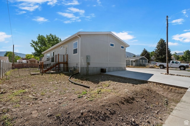 516 N Broadway Ave, Tooele, UT 84074 - view of property exterior featuring a patio, concrete driveway, and a mountain view