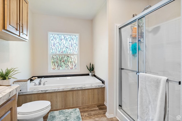 516 N Broadway Ave, Tooele, UT 84074 - full bath with a bath, a stall shower, wood finished floors, and vanity