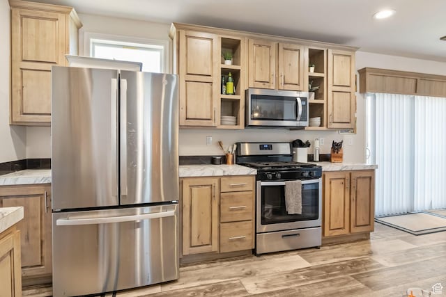 516 N Broadway Ave, Tooele, UT 84074 - kitchen with appliances with stainless steel finishes, open shelves, light wood-style flooring, light brown cabinets, and recessed lighting