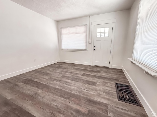3561 S Grant Ave E, Ogden, UT 84401 - foyer entrance with wood finished floors and a textured ceiling