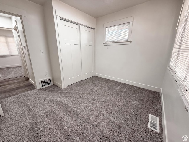 3561 S Grant Ave E, Ogden, UT 84401 - unfurnished bedroom featuring a closet and carpet floors