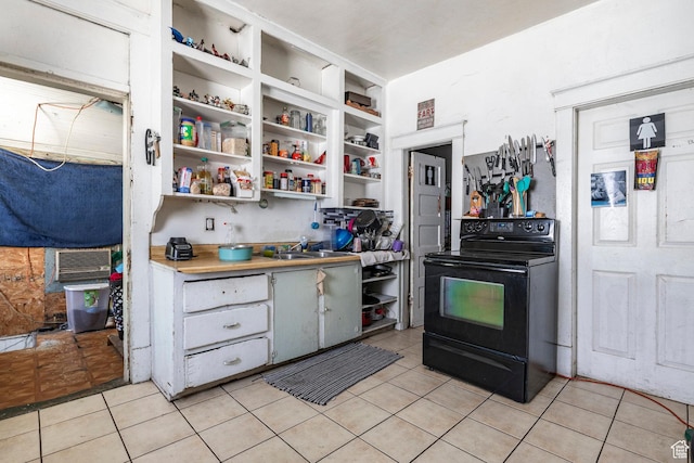 2438 B Ave, Ogden, UT 84401 - kitchen featuring black electric range, light tile patterned floors, open shelves, and light countertops
