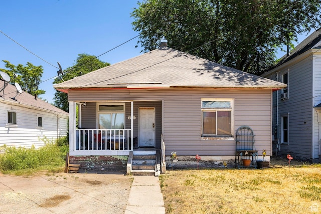 2438 B Ave, Ogden, UT 84401 - view of front of home with covered porch and a shingled roof