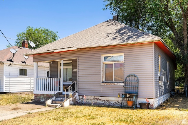 2438 B Ave, Ogden, UT 84401 - view of front of house with covered porch and a shingled roof