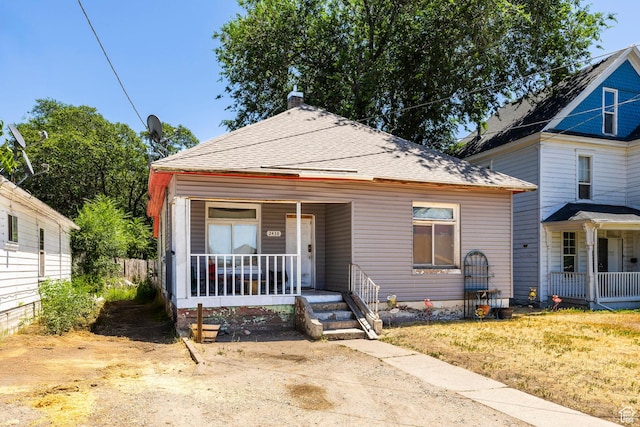 2438 B Ave, Ogden, UT 84401 - view of front of property featuring covered porch and a chimney