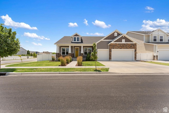 3301 W Cramden Dr, Lehi, UT 84043 - craftsman house featuring stone siding, concrete driveway, and board and batten siding