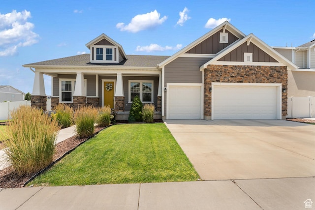3301 W Cramden Dr, Lehi, UT 84043 - craftsman inspired home featuring board and batten siding, an attached garage, concrete driveway, stone siding, and covered porch