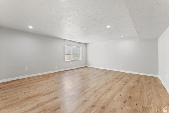 3301 W Cramden Dr, Lehi, UT 84043 - empty room with a textured ceiling, recessed lighting, and light wood-style floors