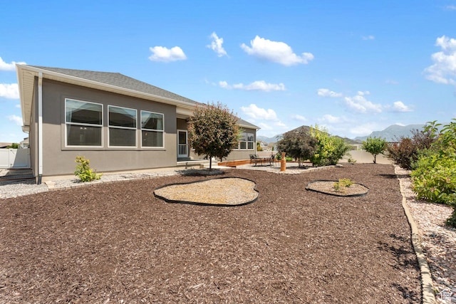 3301 W Cramden Dr, Lehi, UT 84043 - rear view of property with stucco siding, a patio area, and a mountain view